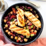 Halloumi chickpea salad inside a black bowl.