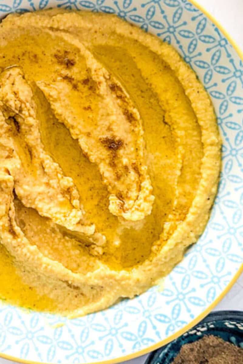 Garlic hummus inside a Moroccan-style bowl.