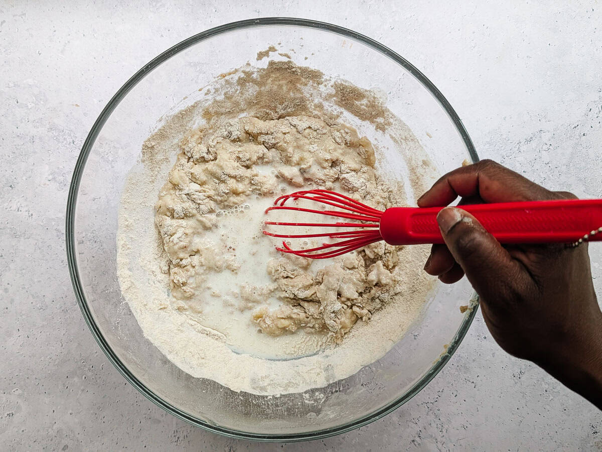 Whisking pancake ingredients in a bowl.