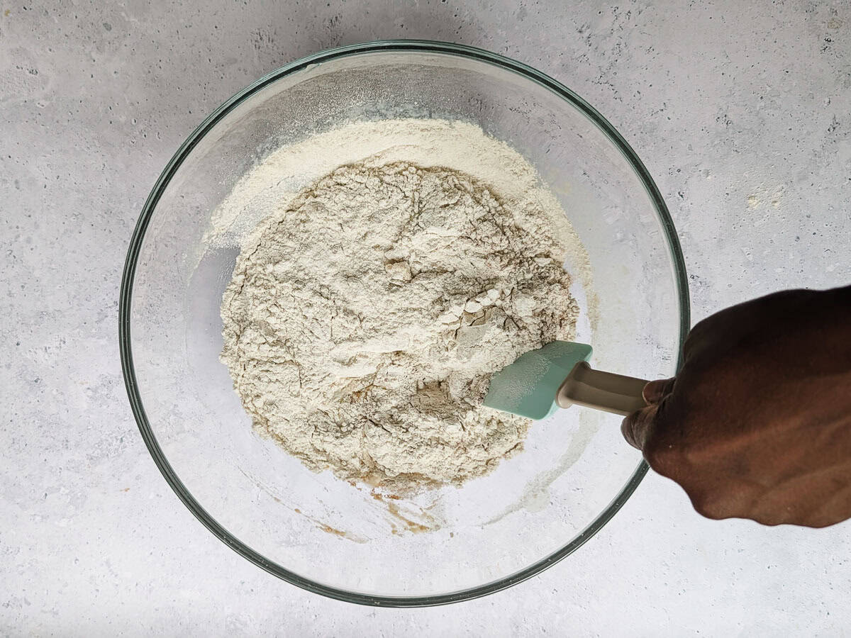 Mixing buckwheat flour and other dry ingredients in a bowl.