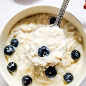 Oat porridge served with blueberries in a bowl.