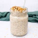 Quinoa overnight oats topped with chopped nuts and nut butter.