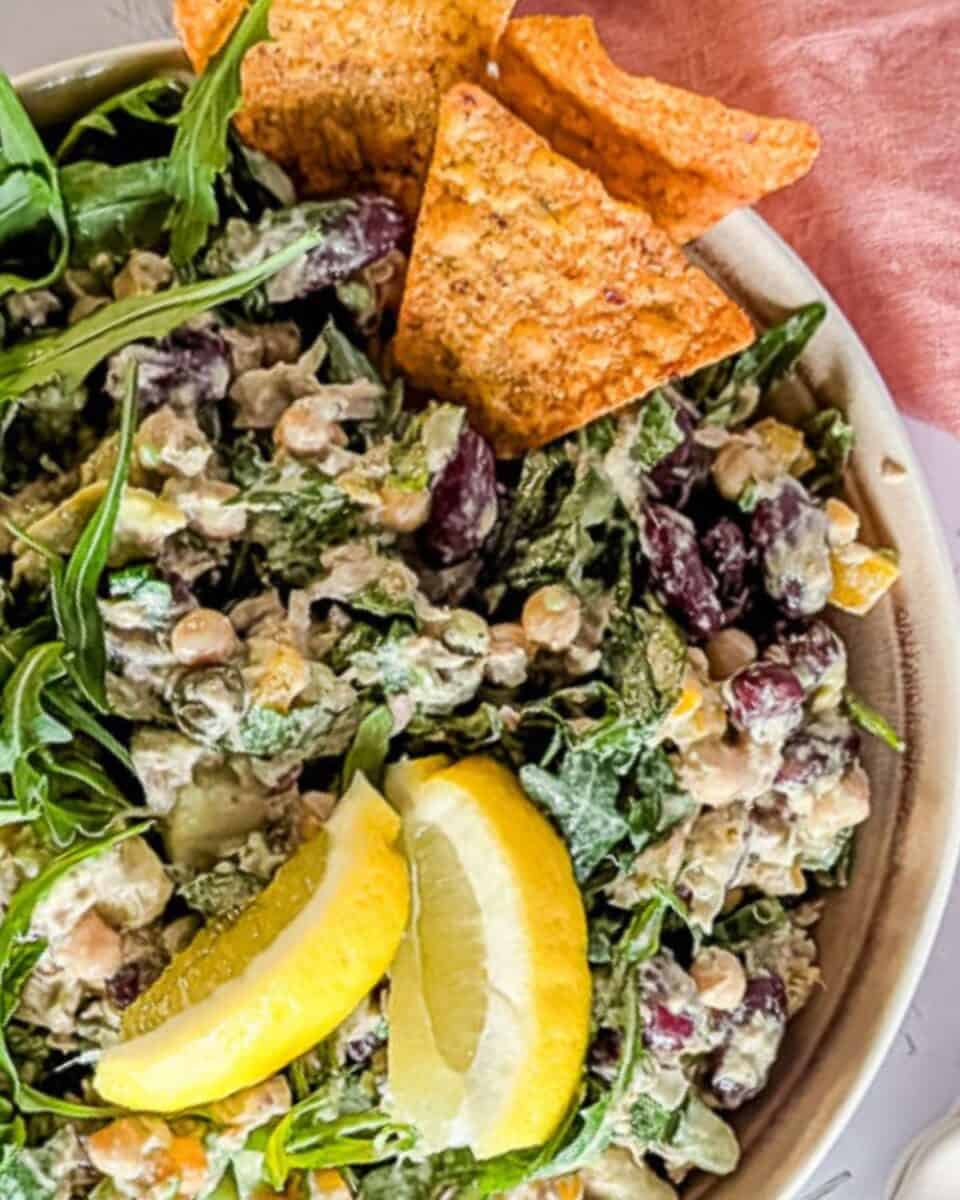 Zoomed-in chickpea tuna salad with arugula and lemon dressing.
