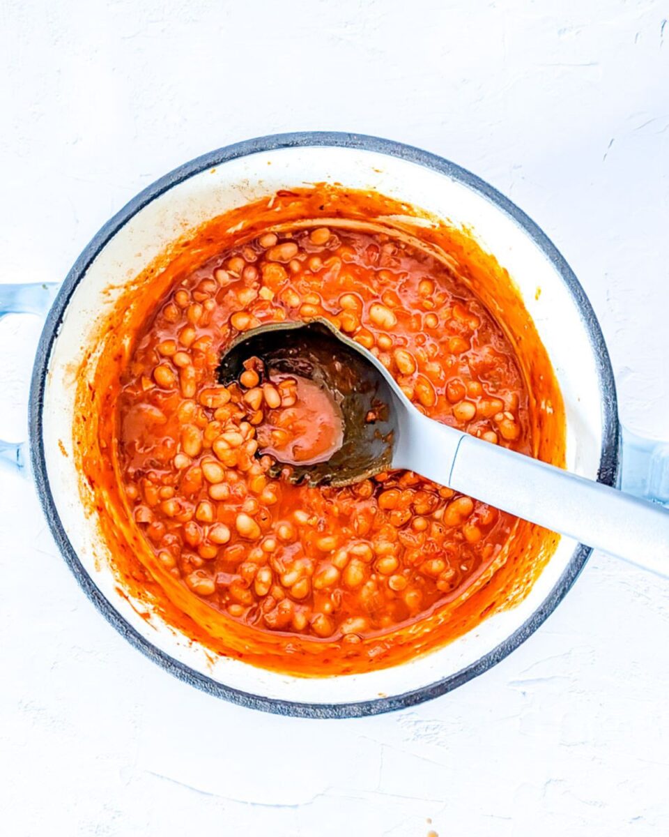 Vegetarian fasoulia in a white pot ready to serve.