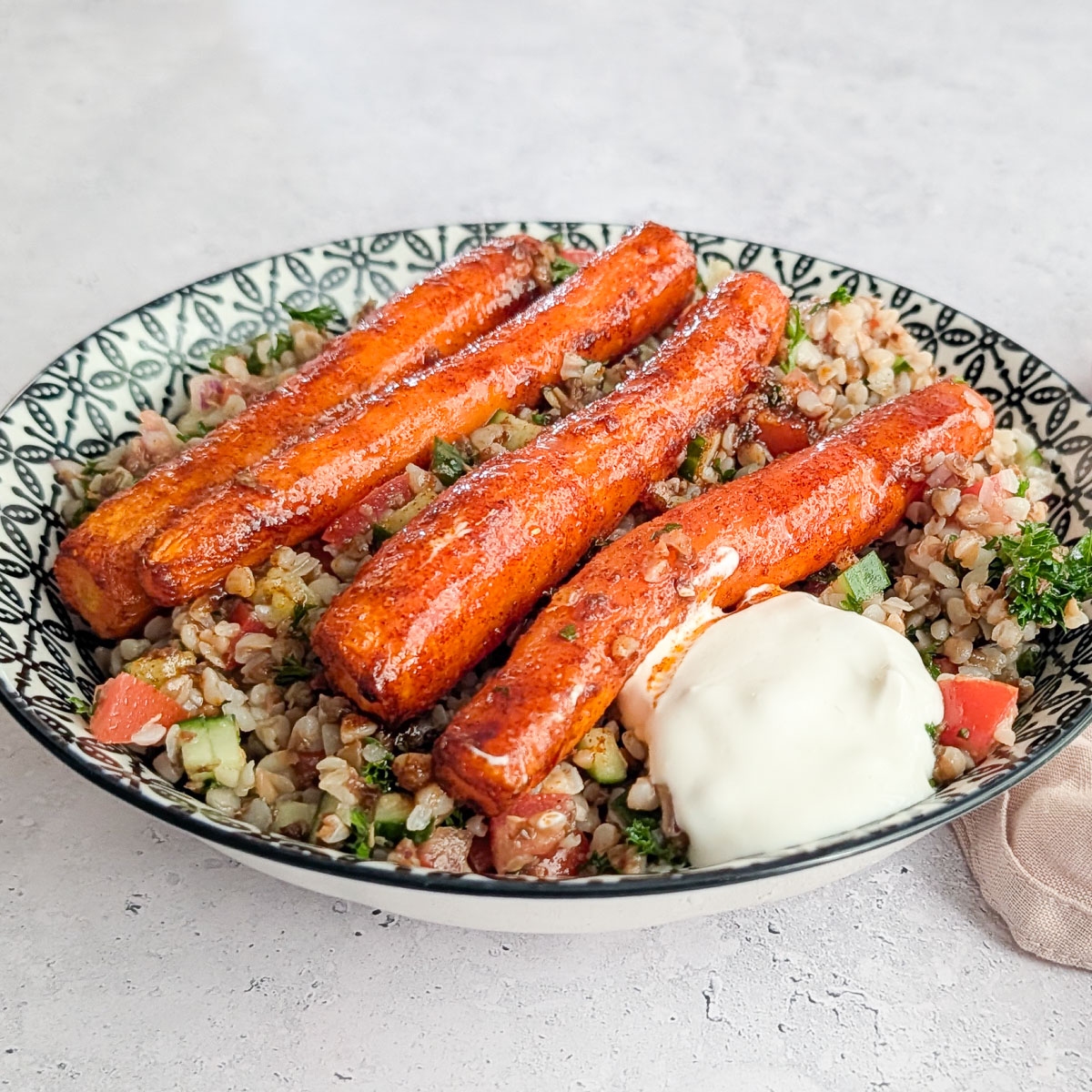 Buckwheat tabbouleh with roasted carrots and some yogurt on top.