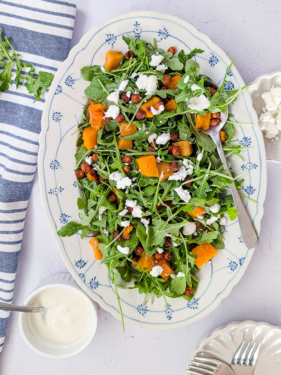 Pumpkin chickpea feta salad with arugula and feta.